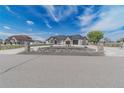 Attractive home featuring stone accents, meticulous landscaping, and circular driveway at 29585 E 165Th Ave, Brighton, CO 80603