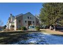 Attractive condominium exterior with stone facade, lush landscaping, and community sign at 7369 S Gore Range Rd # 103, Littleton, CO 80127