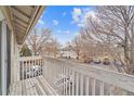 Balcony overlooking neighborhood. Features a beautiful view with ample sunlight, perfect for relaxation at 2285 Coronado Pkwy # D, Denver, CO 80229