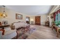 Spacious living room showcasing hardwood floors, elegant furnishings, and neutral color palette at 5753 S Kittredge St, Centennial, CO 80015