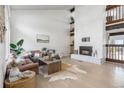 Spacious living room features a fireplace, hardwood floors, and comfortable seating area at 2822 S Uinta St, Denver, CO 80231