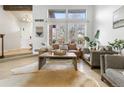 Bright living room with large windows, hardwood floors, and neutral decor for a cozy feel at 2822 S Uinta St, Denver, CO 80231