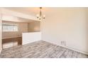Cozy dining room with stylish chandelier and bright natural light at 13086 E Alaska Ave, Aurora, CO 80012