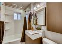 Modern bathroom featuring subway tiles, a sleek vanity, and a shower with a stylish dark curtain at 3736 N Mariposa St, Denver, CO 80211