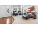 Living room featuring plush furniture, natural light, and decorative accents at 19064 E Oak Creek Way, Parker, CO 80134