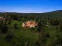 Beautiful mountain home boasting scenic views and lots of natural light at 28532 Hummingbird Hill Rd, Conifer, CO 80433