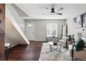 Welcoming living room featuring comfortable seating, stylish decor, and a ceiling fan at 2113 Coronado Pkwy # B, Denver, CO 80229