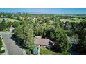 Beautiful aerial view of the property, showcasing mature trees and neighborhood at 10601 E Crestline Ave, Englewood, CO 80111
