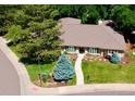 Beautiful home with mature trees and well-maintained landscaping at 10601 E Crestline Ave, Englewood, CO 80111
