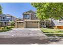 Inviting two-story home boasts a spacious driveway, lovely landscaping, and a welcoming covered porch at 3080 Madison Ln, Broomfield, CO 80023