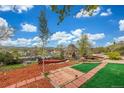 Backyard featuring a gazebo, a fire pit, and beautifully designed landscaping, with views of the city at 15785 W Second Ave, Golden, CO 80401