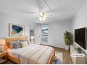 Cozy bedroom with neutral carpet, ample natural light, ceiling fan, and closet at 10930 Albion Ct, Thornton, CO 80233