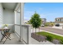 Inviting front porch with seating, offering a relaxing outdoor space with lovely neighborhood views at 42853 Ivydel St, Elizabeth, CO 80107