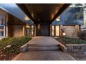 Modern front door entrance with brick and stone accents at 7177 W 8Th Ave, Lakewood, CO 80214