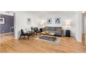 Inviting living room with hardwood floors, sofa, chairs and an open concept design at 2690 Magnolia St, Denver, CO 80207