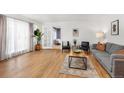 Bright living room with hardwood floors, neutral colors, and comfortable seating area at 2690 Magnolia St, Denver, CO 80207