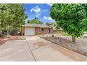 Attractive home featuring a well-maintained front yard and a convenient attached garage at 962 S Potomac Way, Aurora, CO 80012