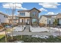 Attractive two-story home with a blend of modern and traditional design elements in neighborhood at 21234 E 63Rd Dr, Aurora, CO 80019