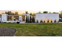 Modern home with a well-manicured lawn, sleek design, and stylish landscaping for curb appeal at 5969 S Humboldt Ct, Centennial, CO 80121