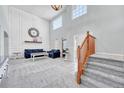 Stunning living room with high ceilings, large windows, and stylish furniture at 5912 Randolph Ave, Castle Rock, CO 80104