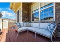 Cozy outdoor patio with comfortable seating, perfect for relaxing and enjoying the natural light at 230 W Jamison Cir # 31, Littleton, CO 80120