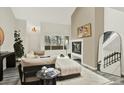 Cozy living room features neutral color palette, fireplace, and view to the kitchen at 8055 E Colorado Ave # 8, Denver, CO 80231