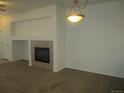 Bright living room with fireplace and neutral colors at 2239 Calais Dr # E, Longmont, CO 80504