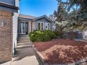 Inviting entrance with brick accents, lush landscaping, and a well-maintained walkway at 22 S Indiana Pl, Golden, CO 80401