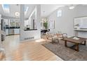 Bright and airy living room featuring skylights, vaulted ceilings, and hardwood floors at 22 S Indiana Pl, Golden, CO 80401