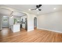 Bright living area showcases hardwood floors and access to the kitchen and other rooms at 5100 Clay St, Denver, CO 80221