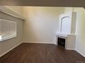 Cozy living area with a fireplace, vaulted ceilings, and lots of natural light at 13959 Eudora St, Thornton, CO 80602