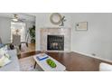 Cozy living room fireplace with marble tile surround creates a warm focal point in the living space at 8260 Washington St # 78, Denver, CO 80229