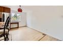 Bright dining room featuring hardwood floors and a light fixture at 4934 S Flower Way, Littleton, CO 80123
