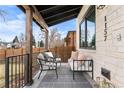 Cozy front porch featuring stylish outdoor seating, a neutral rug, and views of the neighborhood at 1157 Jersey St, Denver, CO 80220