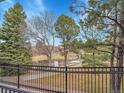 Breathtaking view of pond, landscaping, and walking paths from private balcony at 9085 E Phillips Dr, Centennial, CO 80112