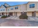 Townhome showcases garages with brick supports and manicured landscaping at 2182 Eagle Ave, Superior, CO 80027