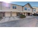 Exterior view of a townhome with driveways leading to garages and green landscaping at 2182 Eagle Ave, Superior, CO 80027