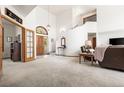 Grand foyer with high ceilings, staircase, and elegant furnishings at 6252 King Dr, Evergreen, CO 80439