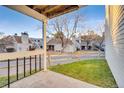 Small patio with view of other units and yard at 13651 E Yale Ave # C, Aurora, CO 80014