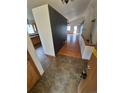 Inviting entryway with wood floors leading to the spacious living area and modern kitchen at 2239 S Truckee St, Aurora, CO 80013