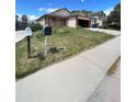 View of front yard of property with house number at 2239 S Truckee St, Aurora, CO 80013