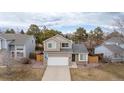 This two-story home includes a well-maintained yard, two-car garage, and beautiful landscaping at 4485 E Andover Ave, Castle Rock, CO 80104