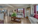 Cozy living room with hardwood floors, comfortable seating, and stylish decor at 16184 Gold Creek Dr, Monument, CO 80132