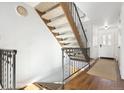 Modern staircase with wood and metal accents at 9044 W 63Rd Ave, Arvada, CO 80004