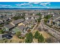 Aerial view of townhomes with landscaping and mountain views in the background at 535 Lost Valley Pt, Castle Rock, CO 80108