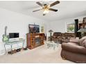 Inviting living room with a fireplace, comfortable seating, and a mounted television at 544 S 3Rd Ave, Brighton, CO 80601