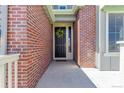 Charming brick home entrance with a decorative wreath on the front door at 12941 Delaware St, Westminster, CO 80234