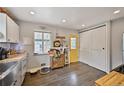 Well-lit kitchen area with gray cabinets, butcher block countertops, and modern appliances at 1801 S Eudora St, Denver, CO 80222