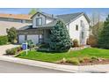 Well-manicured lawn with lush landscaping complements this charming two-story home at 10570 Humboldt Peak Way, Parker, CO 80138