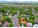 Exterior shot showing the house nestled in a neighborhood with lush greenery and mountain views at 10911 Tennyson Ct, Westminster, CO 80031